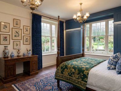 Principal Bedroom - Spacious bedroom with fitted wardrobes and garden views