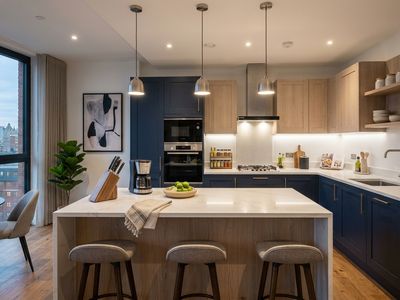 Kitchen - Navy shaker kitchen with marble island and integrated appliances