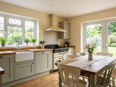 Kitchen & Dining - Open-plan kitchen and dining area with bi-fold doors to the garden
